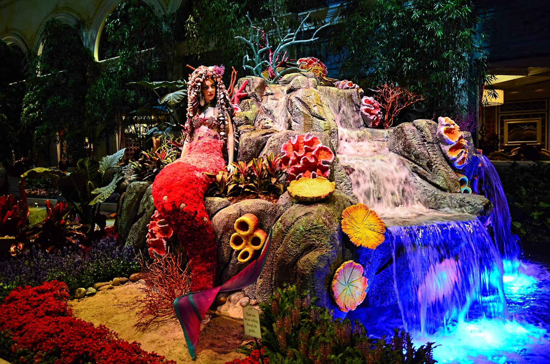 A colorful seasonal floral-and-sculptural installation inside the Bellagio Conservatory & Botanical Gardens in Las Vegas.